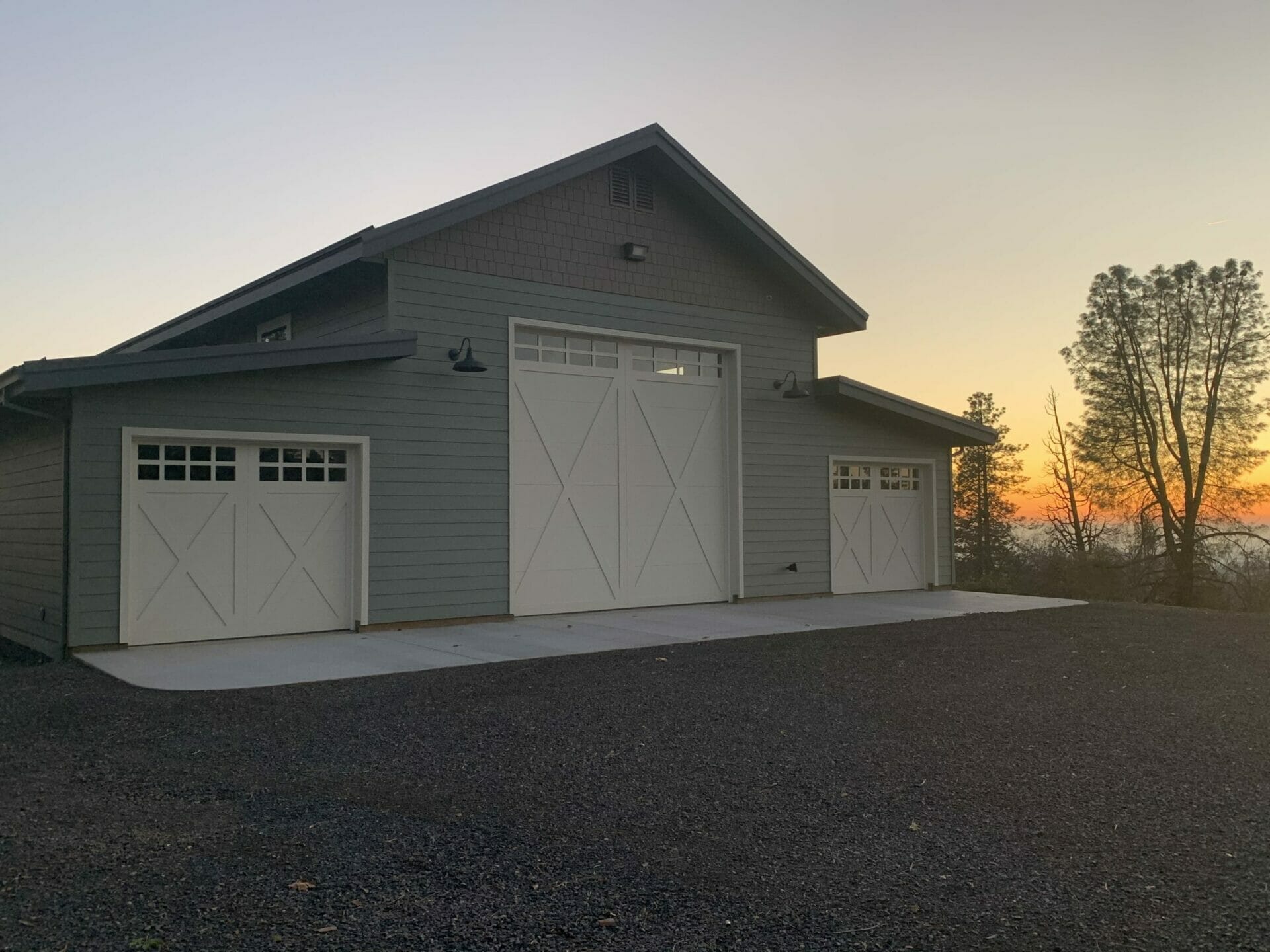 Three custom carriage House Doors installed in a shop.