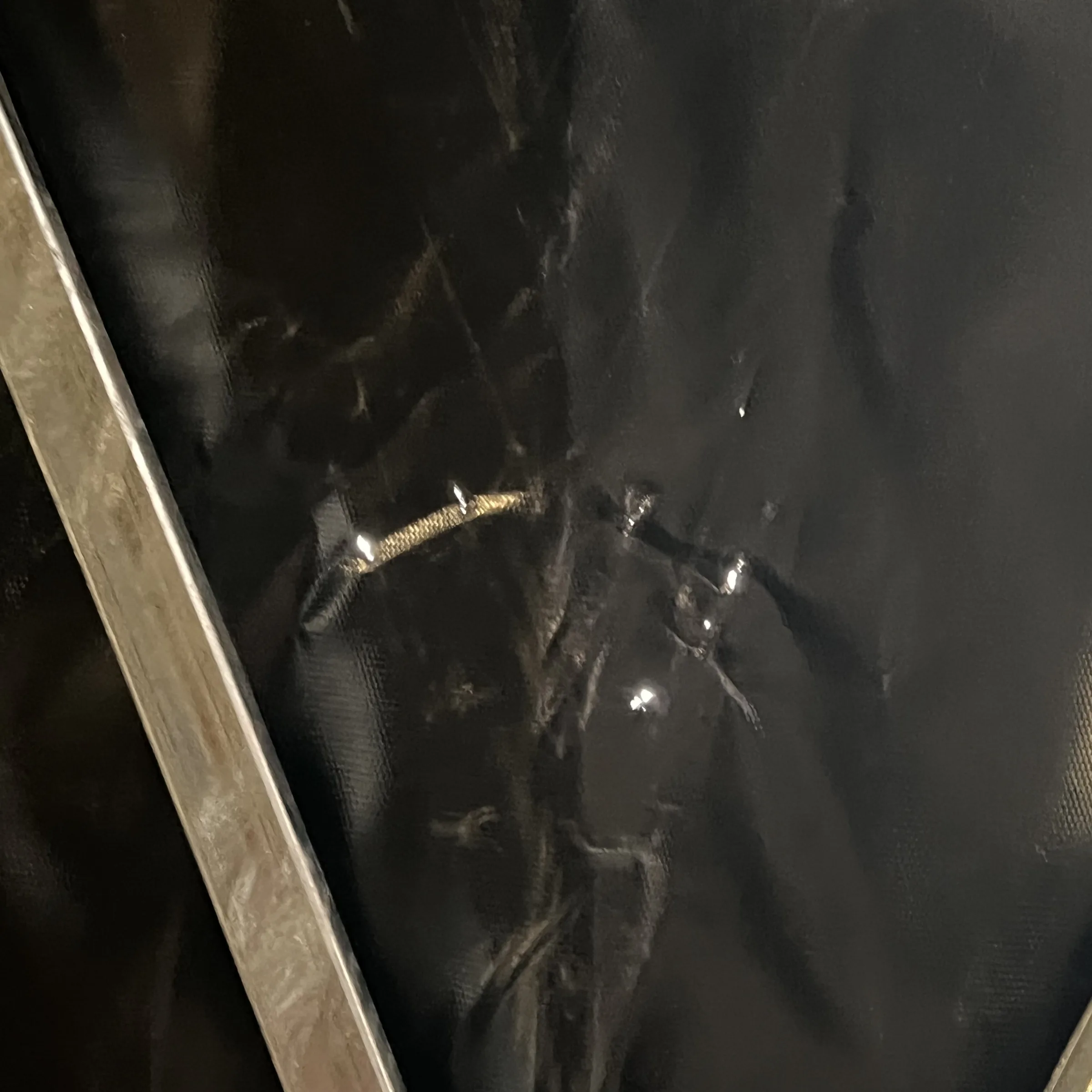 Close view of worn shelter material documented during the Modesto replacement project