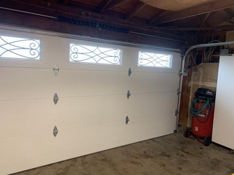 White Amarr garage door with decorative windows installed in Manteca