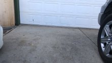 Driveway view of the earlier white garage door at the Manteca home
