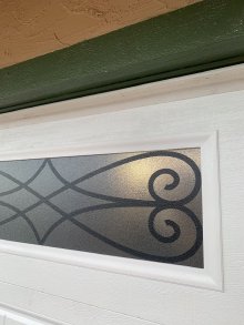 Close view of a decorative black window insert on the Amarr garage door