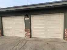 Two white CHI raised-panel garage doors installed at a Ripon home