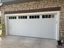 White CHI shaker-panel double garage door installed at a Danville home