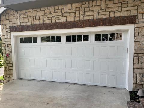 White CHI shaker-panel garage door installed at a Danville home