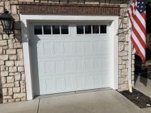 White CHI shaker-panel single garage door installed at the Danville home