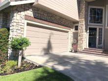 Earlier tan double garage door at the Danville home