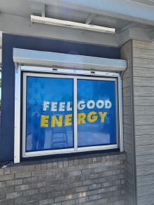 Exterior mounted manual shutter protecting a Dutch Bros service opening