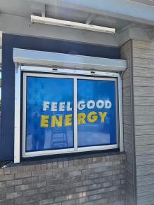 Exterior mounted manual shutter protecting a Dutch Bros service opening