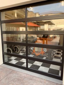 Interior view of a dark-framed full-view glass garage door in Modesto
