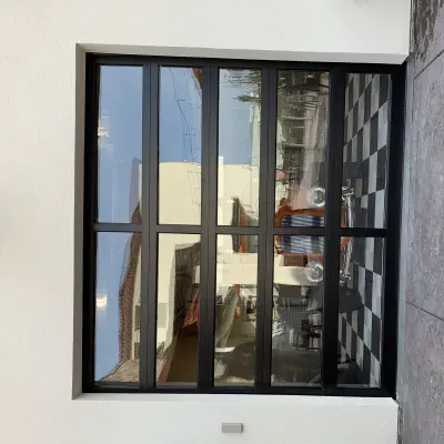 Black full-view glass garage door installed in Modesto