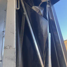 Spring and frame detail on the completed retractable rail dock shelter in Modesto