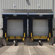 Front view of two new soft-sided dock shelters with rain diverters in Ballico