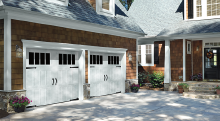 Amarr Classica Northampton garage door in True White with Thames windows and Canterbury Ring handles