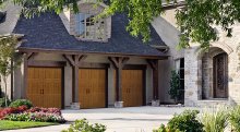 Amarr Classica Tuscany garage door in Golden Oak with Closed Arch top section and Canterbury handles