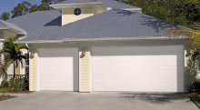 Amarr Heritage short panel garage door in True White with dark tint windows