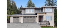Amarr Northwoods Aspen Gray plank garage doors with long panel windows