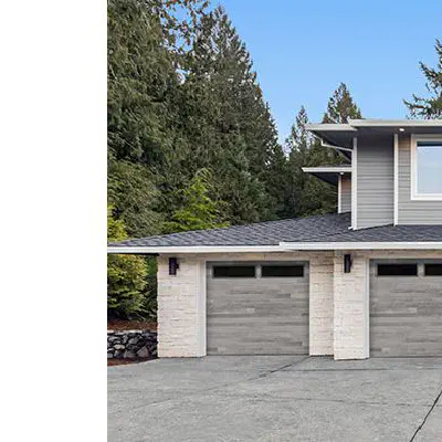 Amarr Northwoods Aspen Gray plank garage doors with long panel windows
