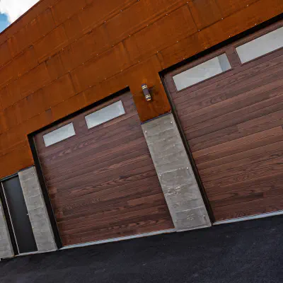 Wood-look CHI garage doors on a modern building