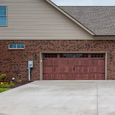 Home exterior with a CHI Accents Woodtones garage door