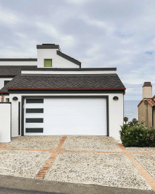 White CHI Skyline Flush garage doors with vertical window stacks