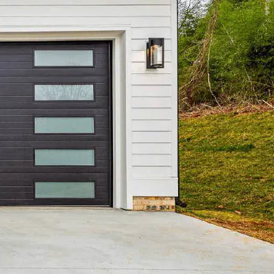 Black CHI Planks garage door on a mid-century style home