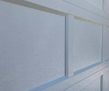 Close-up of C.H.I. recessed steel panel embossing and window trim