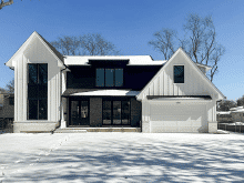 C.H.I. recessed panel garage door installed on a brick home