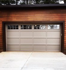 Sandstone C.H.I. recessed panel garage door with decorative window grilles