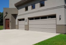 C.H.I. recessed panel garage doors on a traditional home exterior