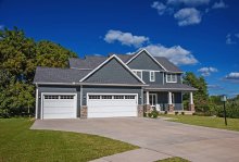 White C.H.I. recessed panel garage door with upper window lites