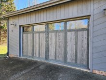 C.H.I. Shoreline driftwood overlay garage door with decorative windows