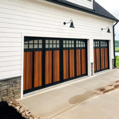 Two-tone black and cedar CHI Shoreline overlay garage door