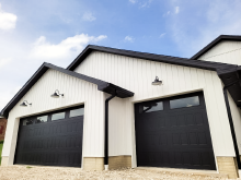 Black CHI Stamped Shaker garage door with clean panel lines