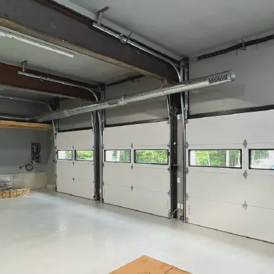 Interior view of a white CHI Sterling garage door with a row of clear windows