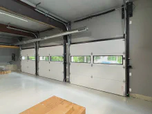 Interior view of a white CHI Sterling garage door with a row of clear windows