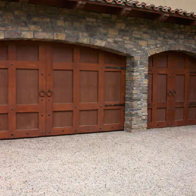 Custom arched wood carriage-house garage door