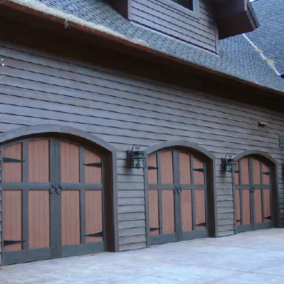 Custom wood carriage-house garage doors on a home