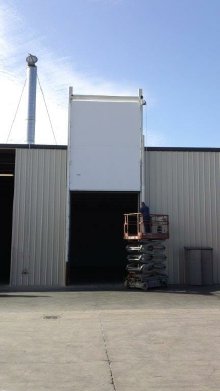 Exterior fumigation-room door service with lift equipment