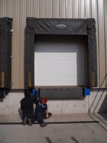 Barton technicians servicing a loading dock seal